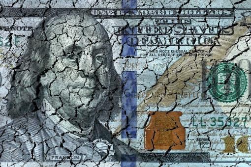 Conceptual finance image of close up damaged and dirty American one hundred dollar bill.
