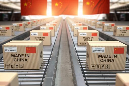 Made in China. Cardboard boxes with text made in China and Chinese flag on the roller conveyor.